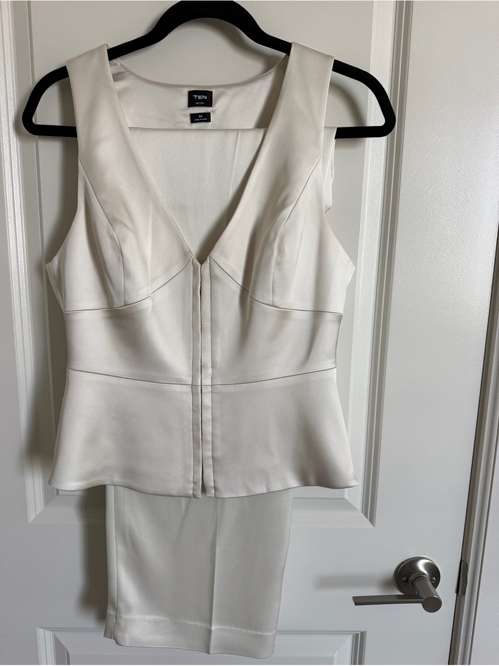 Aritzia White Sleeveless V-Neck Peplum Pantsuit